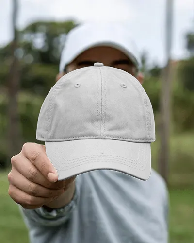 Outdoor Cap Mockup Hand Holding Forward In Focus Green Nature Background Lifestyle Streetwear