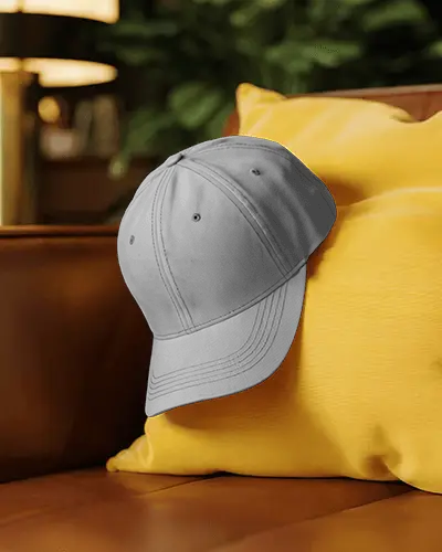 Lifestyle Cap Mockup On Yellow Cushion With Sofa Background Cozy Home Studio Fashion Display