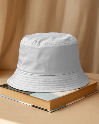 Bucket Cap Mockup Placed On Books Studio Setup With Soft Curtain Background Minimal Display