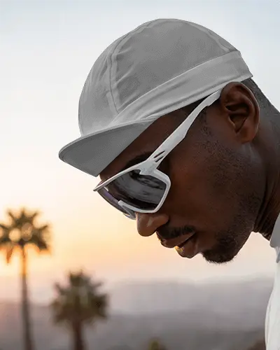 Sunset Cycling Cap Mockup On Athlete With Sporty Sunglasses And Warm Horizon