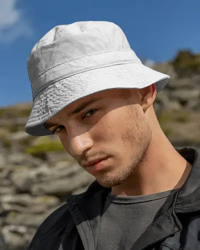 Rugged Bucket Hat Mockup On Model In Sunny Mountain Outdoor Setting