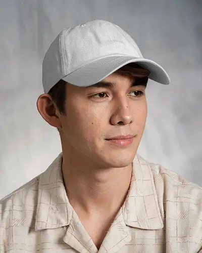 Clean Casual Trucker Cap Mockup On Male Model In Soft Neutral Studio Lighting