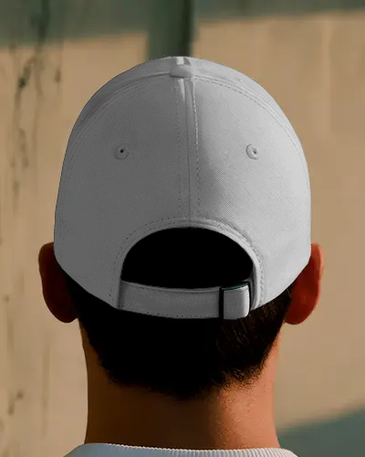 Minimalist Back View Cap Mockup Featuring Sunlit Urban Wall Background