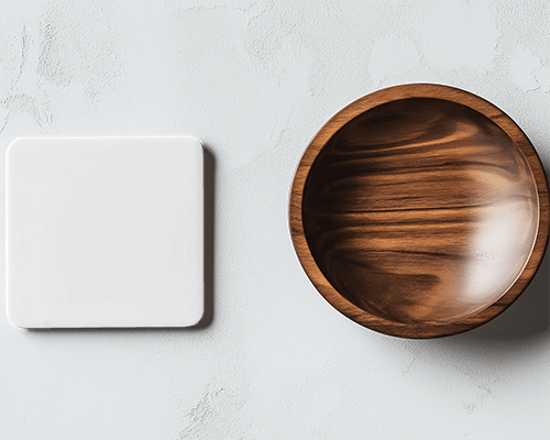 square-coaster-and-wooden-bowl-on-stone-texture