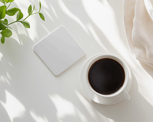 square-coaster-with-coffee-and-shadows-on-white-surface