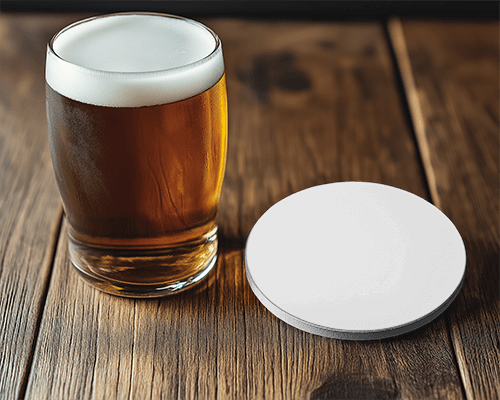 beer-glass-with-round-coaster-on-wooden-table