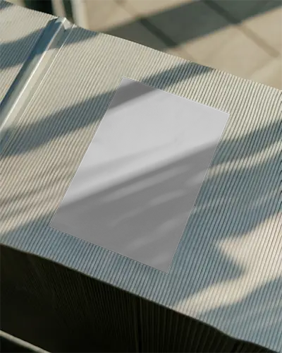 Stylish Blank Poster Display On Ridged Textured Table With Soft Sunlight Effects