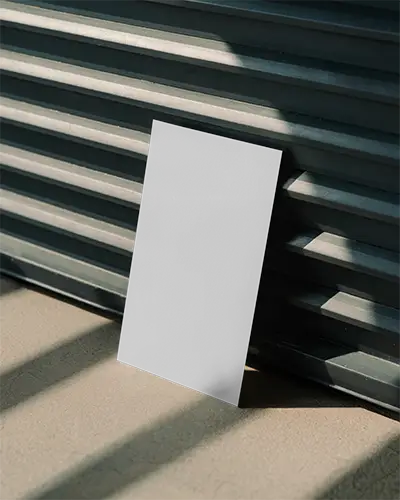 Vertical Blank Poster On Concrete Floor With Shadow Striped Wall Behind Mockup