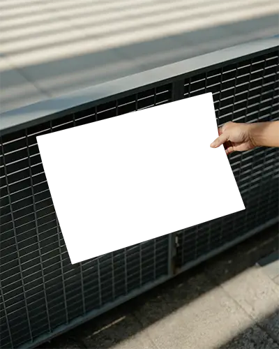 Hand Holding Blank Poster Against Metal Grid Background Outdoor Mockup