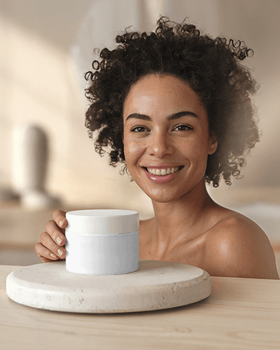 Organic Skincare Branding Mockup Cosmetic Jar On Stylish Stone Platform With Smiling Female Model