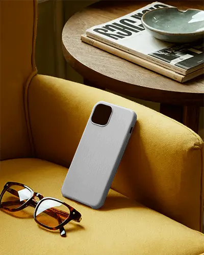 Phone Cover Design Mockup With Glasses And Magazine On Relaxed Seating Environment
