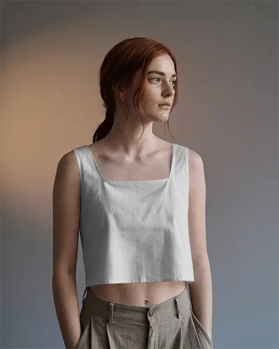 neutral-toned-crop-top-mockup-redhead-model-standing-against-faded-gradient-wall