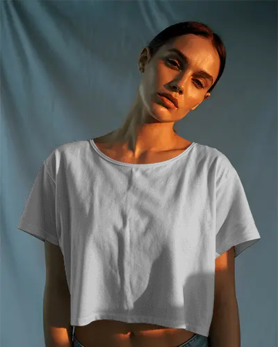 cinematic-vibe-crop-top-mockup-loose-tee-style-in-warm-glow-with-soft-curtain-drop