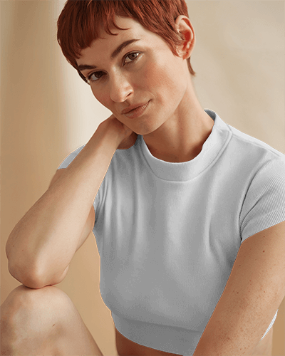 Soft Aesthetic Crop Top Mockup Female Model In Relaxed Pose With Minimalist Floral Rainbow Print