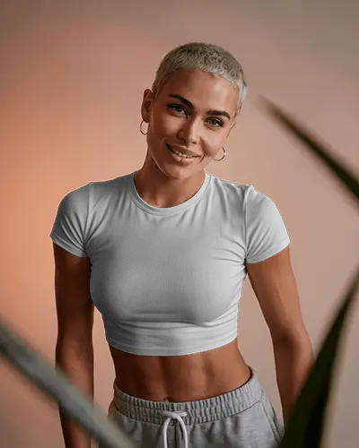 Sporty Crop Top Mockup Smiling Female Model In Light Tee Against Soft Orange Background