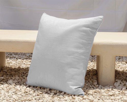 Outdoor Cushion Mockup On Pebble Ground Leaning Against Rustic Bench In Sunlit Setting Relaxed And Cozy Atmosphere 025