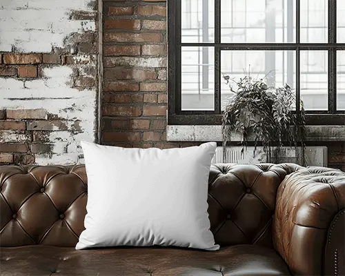 industrial-loft-cushion-mockup-white-pillow-on-brown-leather-sofa-exposed-brick-wall-and-large-window-045