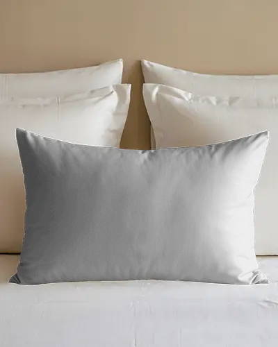 Bedroom Pillow Mockup On White Sheets With Neatly Stacked Pillows Against Beige Wall Soft And Minimal Sleep Space