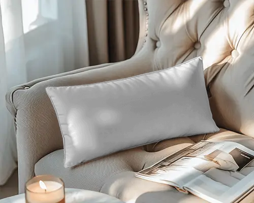 sunlit-cozy-interior-cushion-mockup-rectangle-pillow-on-armchair-with-open-magazine-and-candle-057