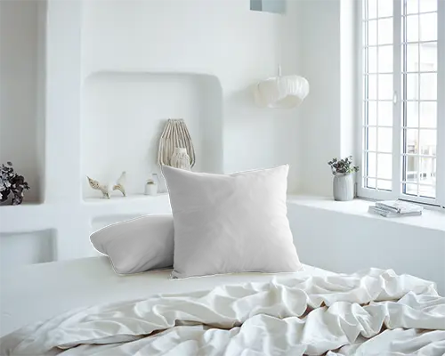soft-light-cushion-mockup-two-pillows-on-white-bed-in-modern-sunlit-room-058