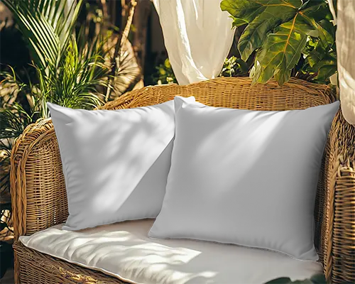 outdoor-rattan-cushion-mockup-two-white-pillows-on-wicker-sofa-in-sunny-garden-with-greenery-061