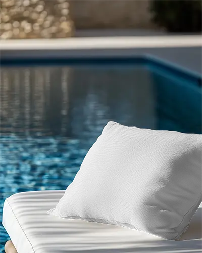 poolside-cushion-mockup-white-pillow-on-lounger-with-reflective-water-in-sunny-outdoor-setting-064