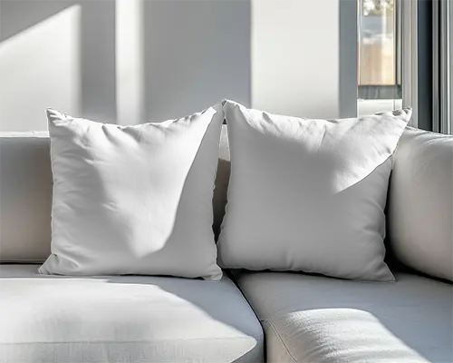 modern-living-room-cushion-mockup-two-white-pillows-on-sofa-in-sunlit-interior-with-soft-shadows-065
