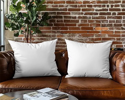 urban-loft-cushion-mockup-white-pillows-on-brown-leather-sofa-with-brick-wall-and-indoor-plant-066