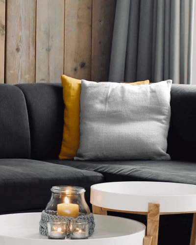 Plush Cushion Mockup On Dark Sofa