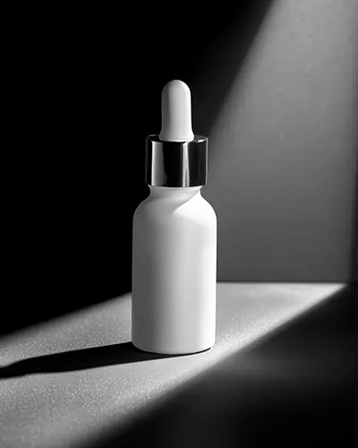 Elegant Dropper Bottle Mockup Showcasing Minimalist Design And Versatile Packaging Options