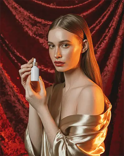 Luxury Dropper Bottle Mockup Golden Silk Aesthetic With Red Velvet Background