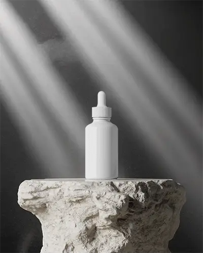 Elegant Dropper Bottle Mockup With Natural Light And Textured Stone Base