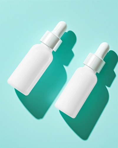 Dropper Bottle Mockup Minimalist Design On Light Blue Background With Soft Shadows Elegant And Clean Aesthetic 045