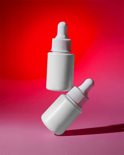 Dropper Bottle Mockup Red And Pink Background Dramatic Lighting Floating Effect 051