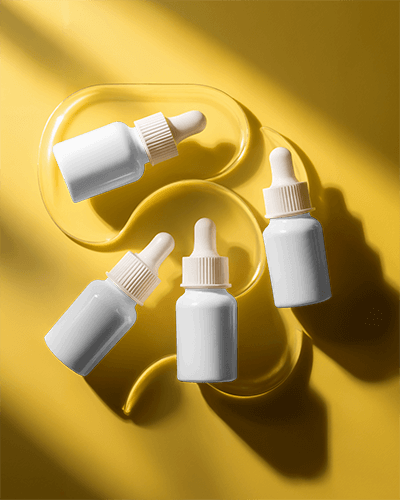 Dropper Bottle Mockup Golden Liquid Four Bottles Sophisticated Skincare Glossy Luxury 064