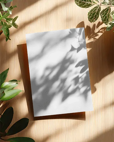 high-resolution-flyer-mockup-showcasing-shadow-play-from-nearby-plants-on-textured-wood