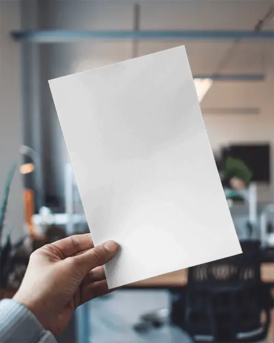 Modern Office Flyer Mockup Male Hand Holding Paper Upright Blurred Workspace Background With Cool Toned Lighting And Clean Composition 0109