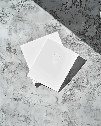 Angled Top View Double Flyer Mockup On Textured Concrete Surface Soft Pastel Gradient Designs Calm Shadow Play Modern And Minimalist Aesthetic 0116