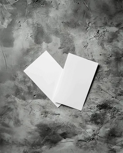 Artistic Angled Flyer Pair Mockup Against Dark Textured Cement Background 0119