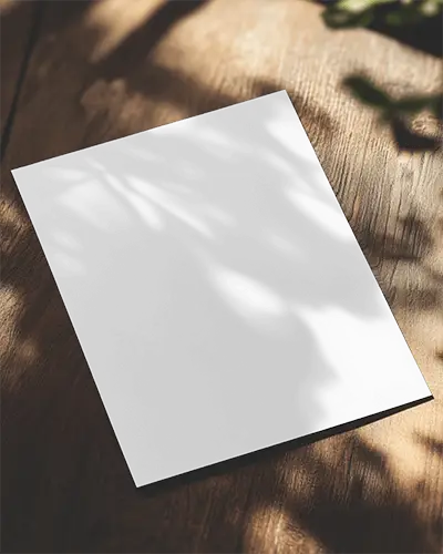 Angled Golf Flyer Mockup On Wooden Surface Dappled Sunlight With Leaf Shadows Vibrant And Playful Design Layout 0126