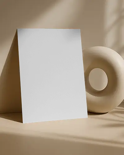 Premium Flyer Mockup Leaning On Sculpture In Beige Studio Soft Light And Shadow Play