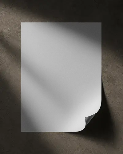 Dramatic Top Down Flyer Mockup Curled Edge On Dark Stone Background With High Contrast Lighting Effect