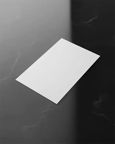 Elegant Top View Flyer Mockup On Black Marble Surface With Fine Veining And Smooth Light Fade Gradient
