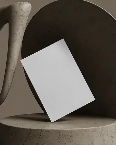 Abstract Sculpture Flyer Mockup Leaning On Marble Shapes In Earth Toned Minimalist Studio Scene