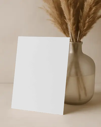 Angled A4 Flyer Mockup Next To Glass Vase With Dried Flowers Warm Neutral Tones Natural Light