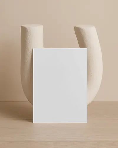 Upright A6 Flyer Mockup Against Cream Textured Ceramic Sculpture Natural Light Soft Tone