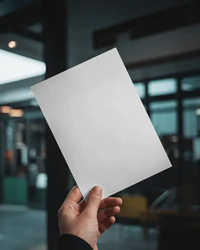 urban-handheld-flyer-mockup-in-modern-cafe-setting-with-soft-daylight-and-glass-doors