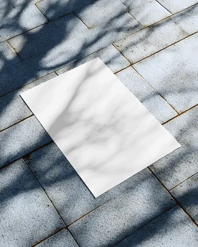 outdoor-flyer-mockup-on-tiled-ground-with-natural-tree-shadow-cast-for-design-presentation