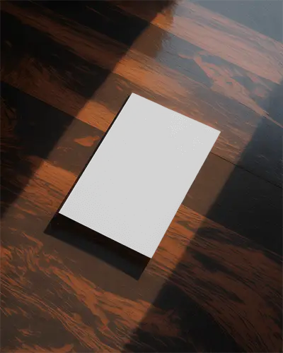 minimalist-flyer-mockup-on-wood-textured-surface-with-dramatic-light-and-shadow-effect