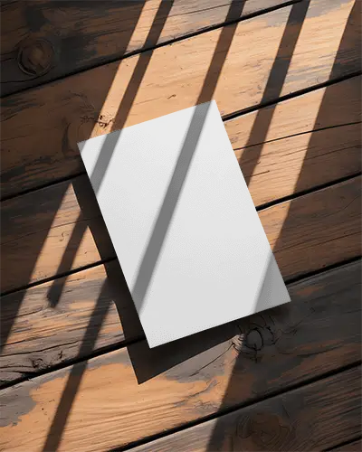 minimalistic-flyer-mockup-on-textured-wooden-floor-with-dramatic-light-and-shadows